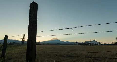 Sunset mountain time lapse with cows and fence Stock Footage 165241332