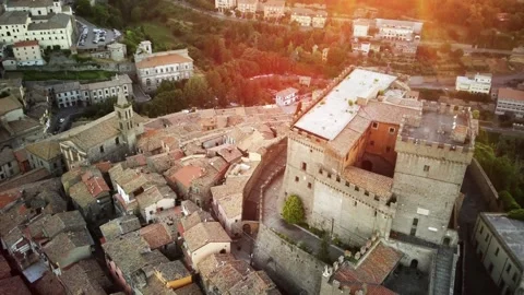Sunset in a mountain town, view from a drone. the sun sits behind the mountains Video stock 250888031