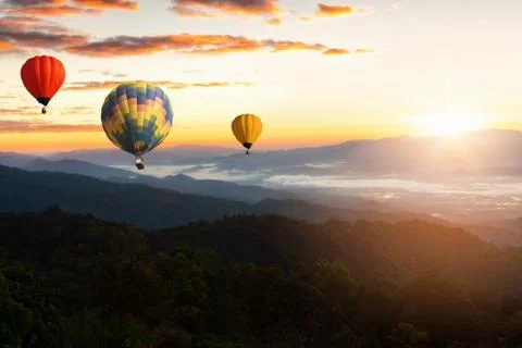 Sunset Mountain View has a floating balloon in the sky. Stock Photos