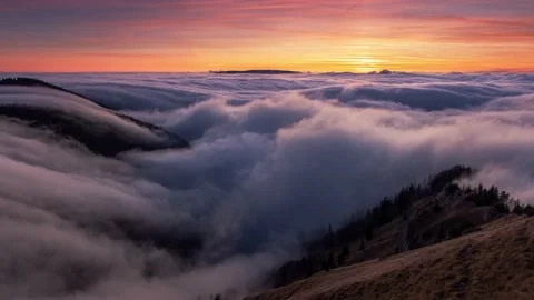 Sunset mountains above clouds during inversion, beautiful landscape - Time lapse Stock Footage 146495508
