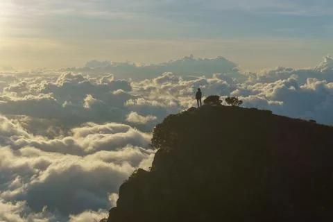 Sunset in the mountains above the clouds Stock Photos