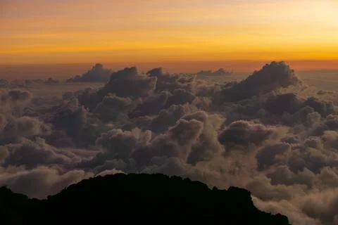 Sunset in the mountains above the clouds Foto stock