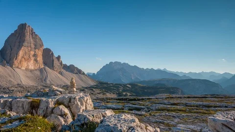 Sunset in the Mountains and the Pyramid of Balanced Stones. Time Lapse UHD Stock Footage 106464235