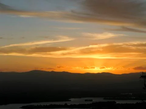 Sunset with mountains and river Stock Photos