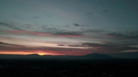 Sunset with mountains in the background aerial drone Stock Footage 225237899