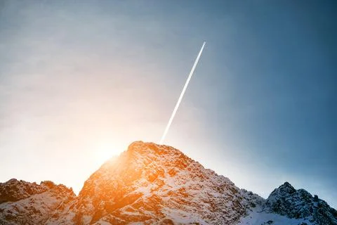 Sunset in the mountains. Beautiful peaks of snowy mountains Stock Photos