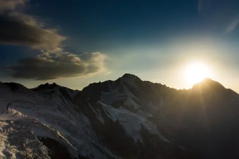 Sunset in the mountains. Clouds and sky Stock Photos
