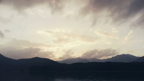 Sunset in the mountains with the cloudy sky time lapse Stock Footage 77449872