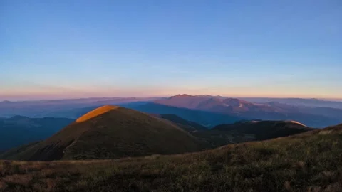 Sunset in the mountains in the evening, dusk. Time laps. Stock Footage 144401378
