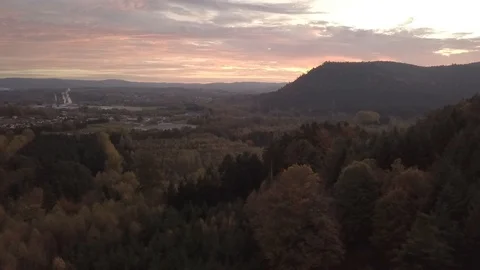 Sunset on mountains forest plain and town 1080 ungraded Stock Footage 105954009