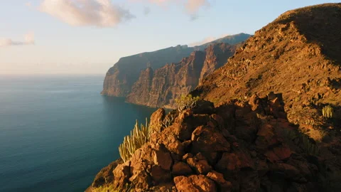Sunset in mountains Los Gigantes Cliffs with deep ocean view Tenerife island Stock Footage 233267205