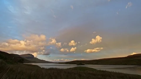 Sunset in mountains - Old Man Storr and lake in Scotland, time-lapse Stock Footage 84844040