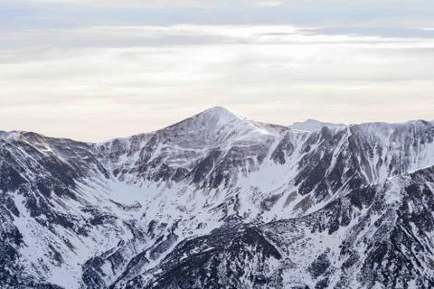 Sunset in the mountains, orange sunset, clouds, sky and mountains Stock Photos