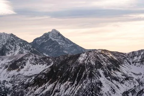 Sunset in the mountains, orange sunset, clouds, sky and mountains Stock Photos