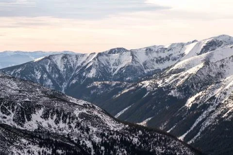 Sunset in the mountains, orange sunset, clouds, sky and mountains Stock Photos
