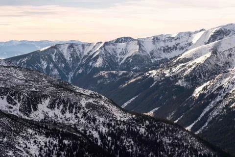 Sunset in the mountains, orange sunset, clouds, sky and mountains Stock Photos