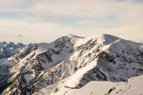 Sunset in the mountains, orange sunset, clouds, sky and mountains Stock Photos