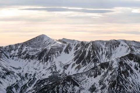 Sunset in the mountains, orange sunset, clouds, sky and mountains Stock Photos