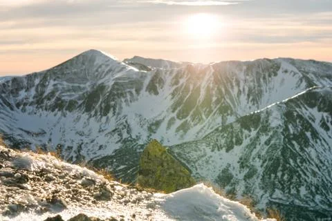 Sunset in the mountains, orange sunset, clouds, sky and mountains Stock Photos