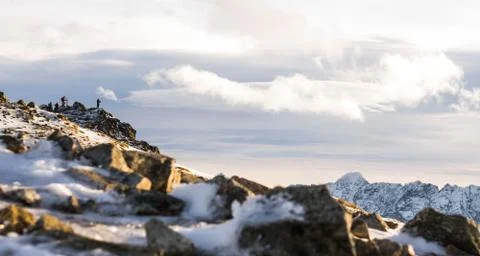 Sunset in the mountains, orange sunset, clouds, sky and mountains Stock Photos