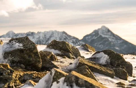 Sunset in the mountains, orange sunset, clouds, sky and mountains Stock Photos