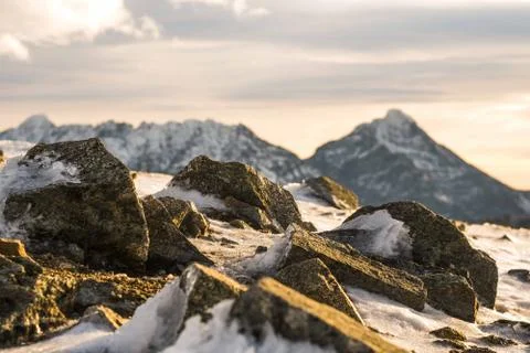 Sunset in the mountains, orange sunset, clouds, sky and mountains Stock Photos