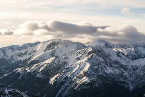 Sunset in the mountains, orange sunset, clouds, sky and mountains Stock Photos