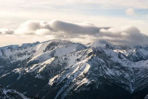 Sunset in the mountains, orange sunset, clouds, sky and mountains Stock Photos