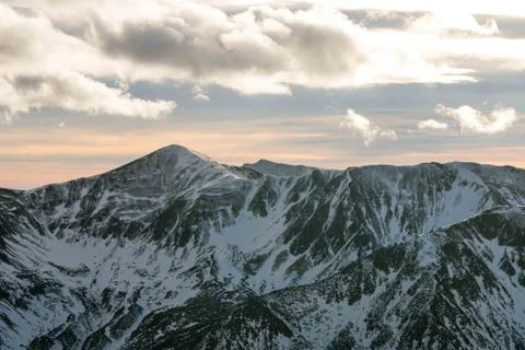 Sunset in the mountains, orange sunset, clouds, sky and mountains Stock Photos
