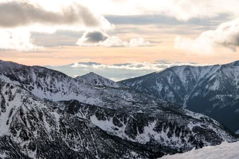 Sunset in the mountains, orange sunset, clouds, sky and mountains Stock Photos