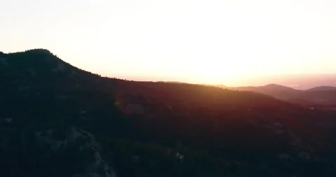 Sunset in the mountains over mountain roads Stock Footage 203595725