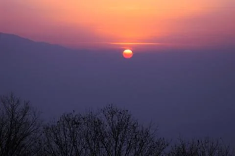 Sunset at mountains Stock Photos