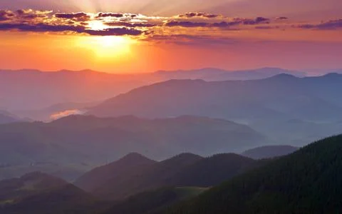 Sunset in mountains Stock Photos