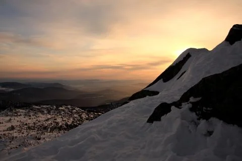 Sunset is in mountains. Stock Photos
