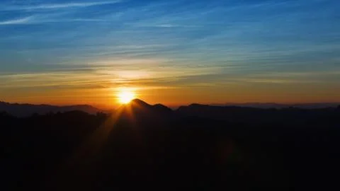 Sunset in the mountains range Stock Photos