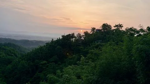 Sunset in the mountains. Sunset Over Forested Hills at Golden Hour Stock Photos