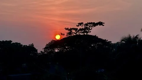 Sunset in the mountains. Sunset Over Forested Hills at Golden Hour. Stock-Fotos