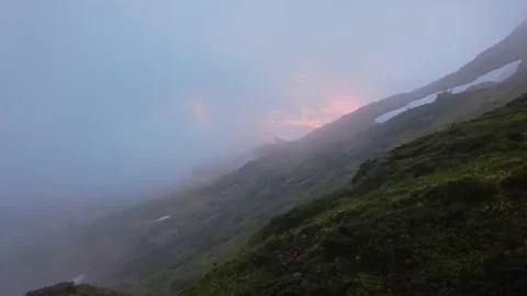 Sunset in the mountains through the clouds Video stock 156763097