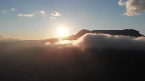 The sunset in mountains through the clowds Stock Footage 155926981