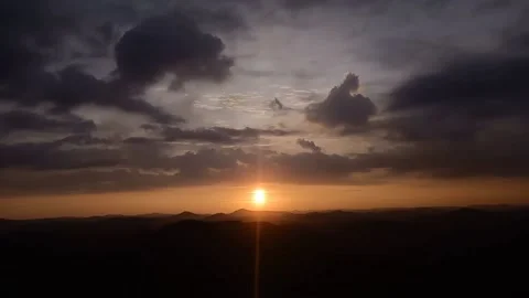 Sunset at the mountains time lapse video Stock Footage 164676049