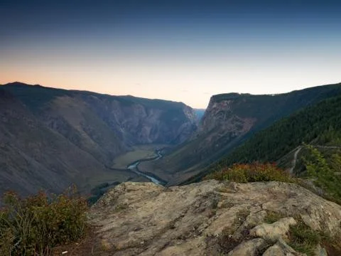 Sunset in the mountains. Valley of the river 写真素材