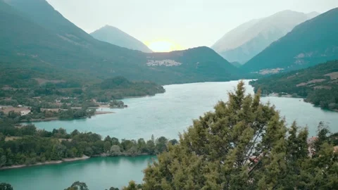 Sunset in the mountains. view of the lake between the Italian mountains Stock Footage 144943074