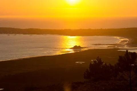 Sunset at the mouth of a river Stock Photos