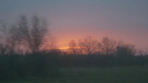 Sunset from moving car window 스톡 동영상 71133856