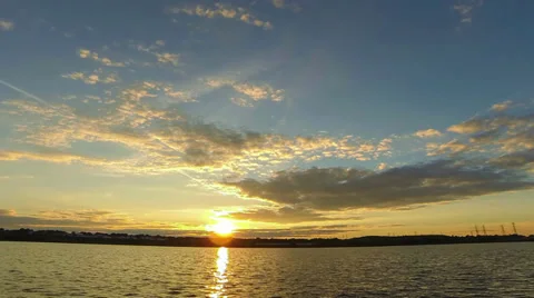 Sunset with moving clouds Stock Footage 31159993