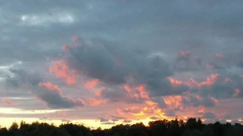 Sunset with moving clouds timelapse Stock Footage 10756148