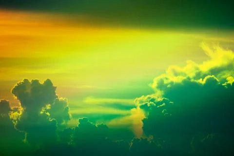 Sunset multicolor cloud back on dark silhouette sky and fishing boat on sea 写真素材