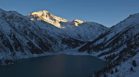Sunset near the lake and the mountains around , Big Almaty lake Stock Footage