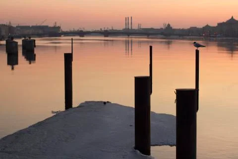 Sunset on the Neva River in March, the last ice on the river in the spring. Stock Photos
