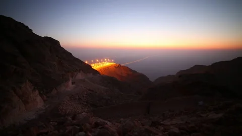 Sunset night light al ain mountain area traffic road 4k timelapse uae Stock Footage 208126098